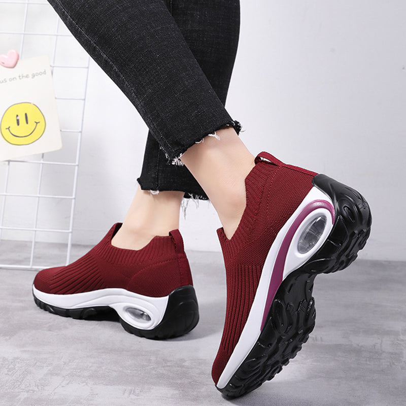 Sneakers Women Air Cushion Mesh Breathable Running Sports Shoes in red, showcased during casual wear from a side angle.
