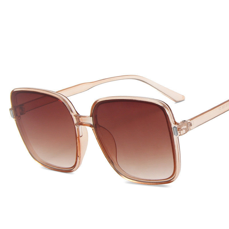 Big Square Sunglasses in transparent pink with brown gradient lenses, stylish and modern for a chic look.