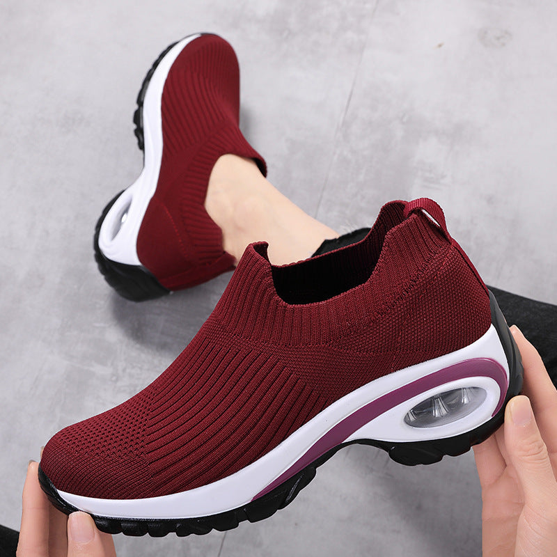 Sneakers Women Air Cushion Mesh Breathable Running Sports Shoes in burgundy color with a comfortable knit design.